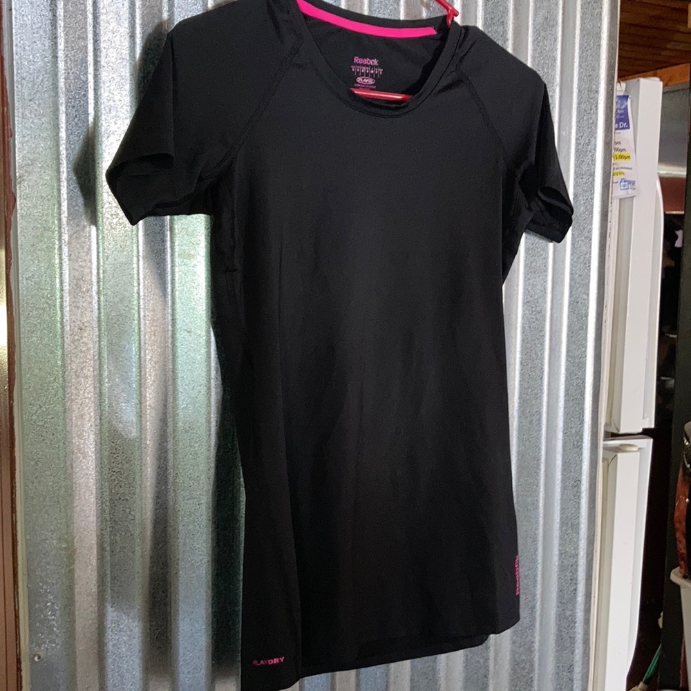 Reebok women’s tshirt. Spandex material. Used in good condition